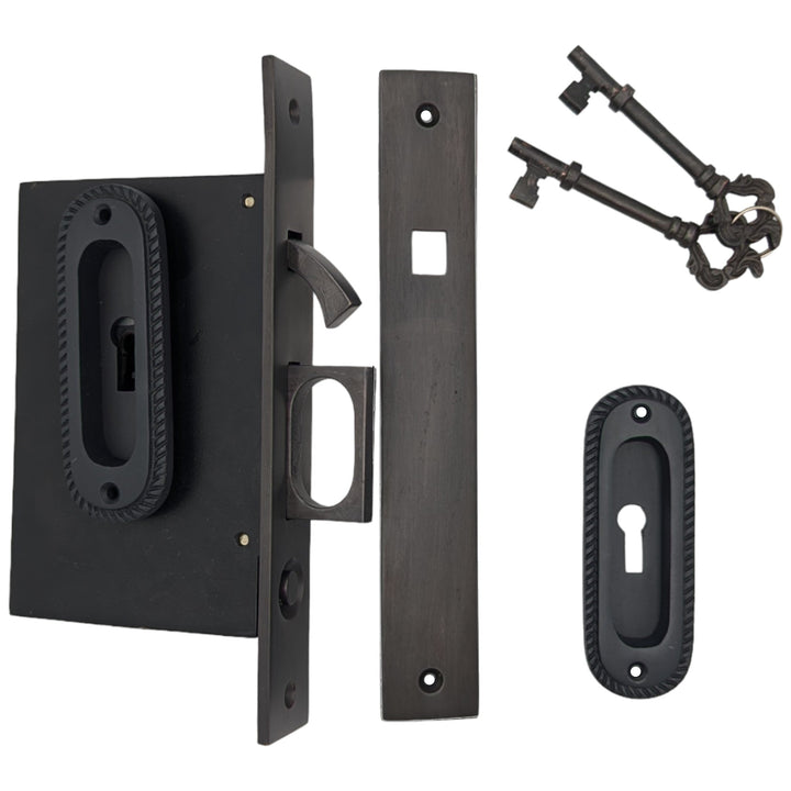 Georgian Oval Pattern Pocket Privacy (Lock) Style Door Set COPPER MOUNTAIN HARDWARE